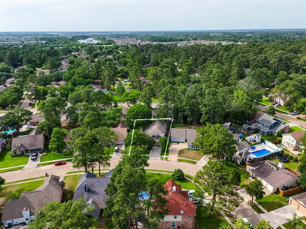 Take in the aerial perspective of your future home, tucked beneath the trees on a spacious lot in the heart of Oakwood Glen, just moments from neighborhood parks, the pool, and everyday conveniences.