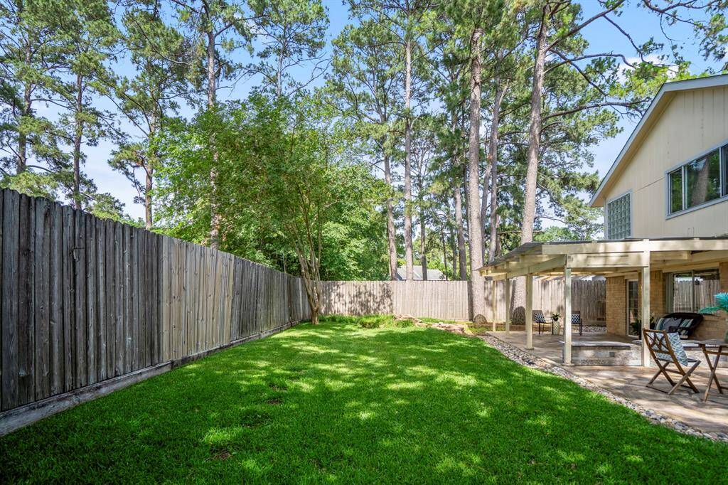 Looking across the generous greenspace, you’ll appreciate just how much room this backyard offers. With the house off to the right, there's plenty of open lawn for gardening, relaxing, or creating your own backyard vision.
