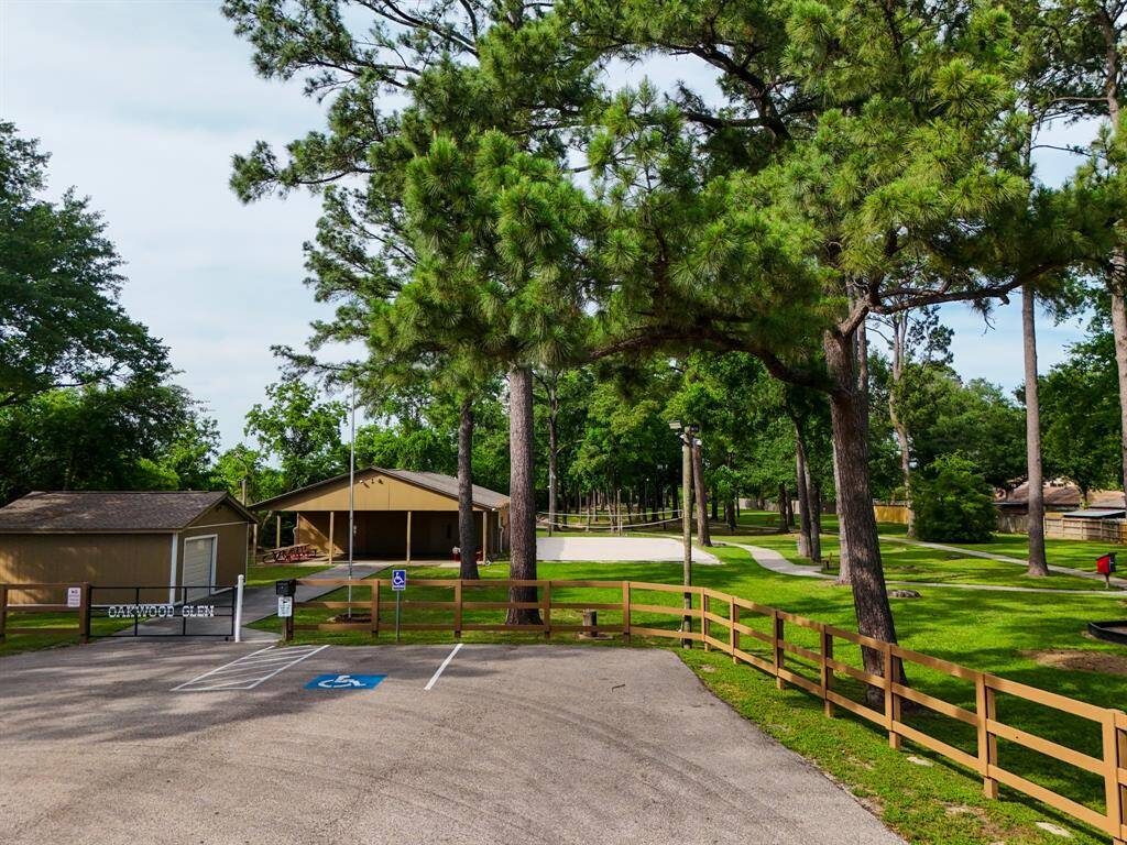 One of Oakwood Glen’s clubhouse spaces offers a welcoming spot for gatherings and events, with a sand volleyball court nearby adding an active, social element to the community’s amenities.