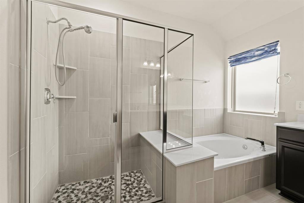 Primary ensuite separate shower and soaking tub