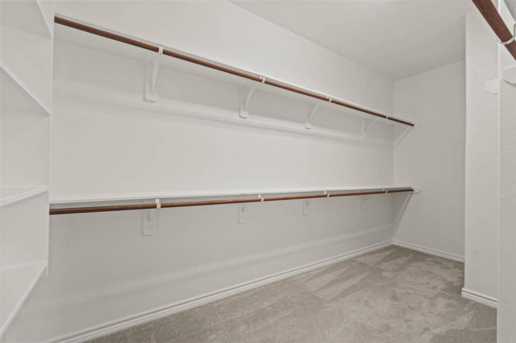 Large walk-in closet in primary suite
