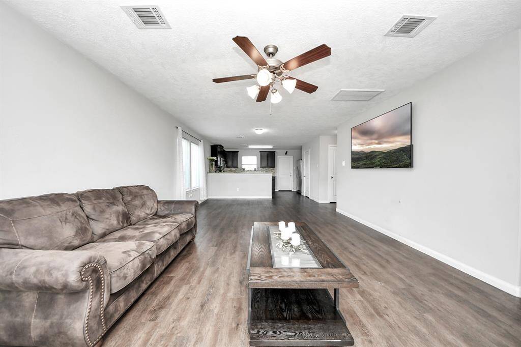 The heart of the home, this spacious living room offers a warm and inviting ambiance