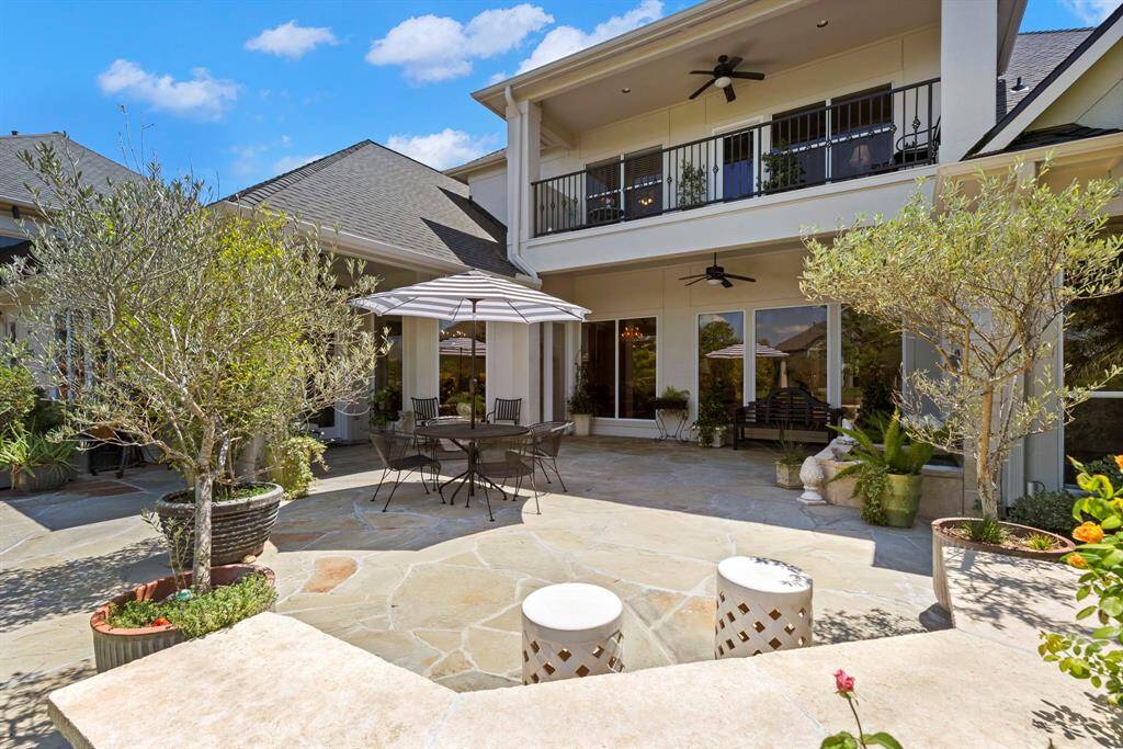 View of home and balcony from  the patio