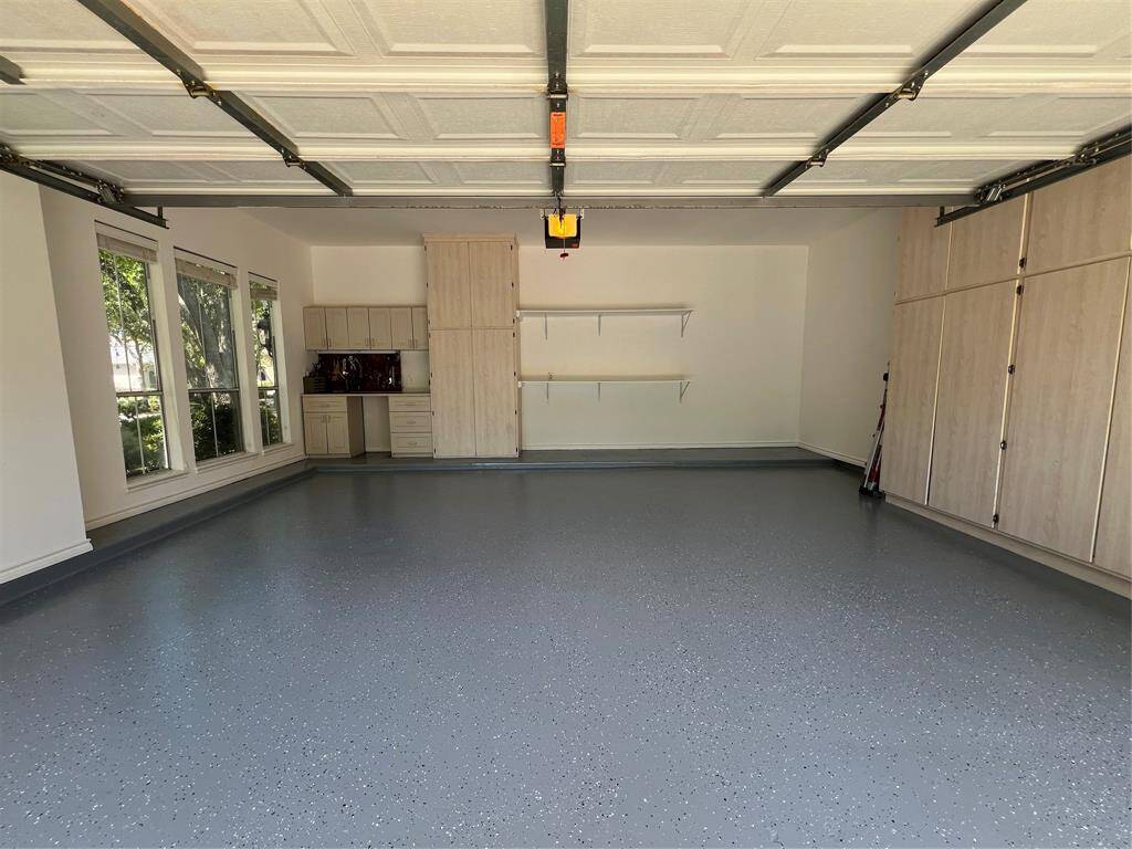 Double Garage with work bench and hidden storage. Also has new Epoxy fleck floor