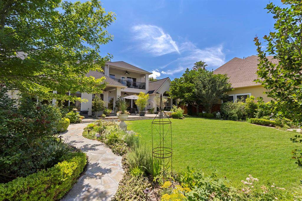 This fabulous back yard is a bird and butterfly paradise, not to mention all of the beautiful flowers.