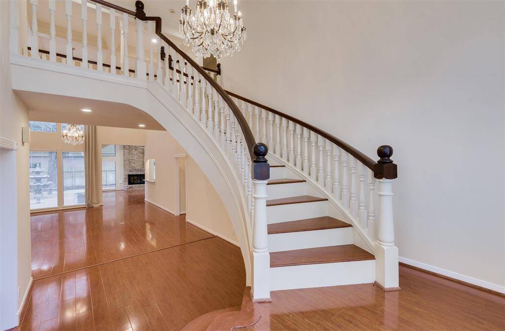 The sweeping staircase offers a grand entrance to this home.
