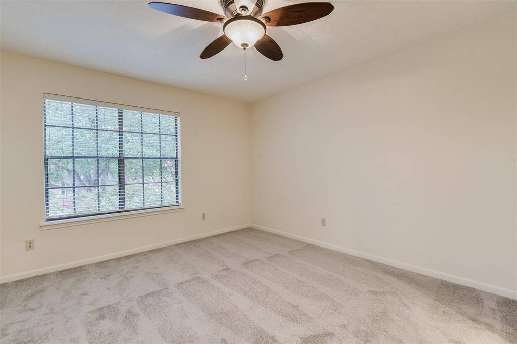 One of three spacious bedrooms upstairs boasts 13x12 sf of space, fresh paint, and new carpet.