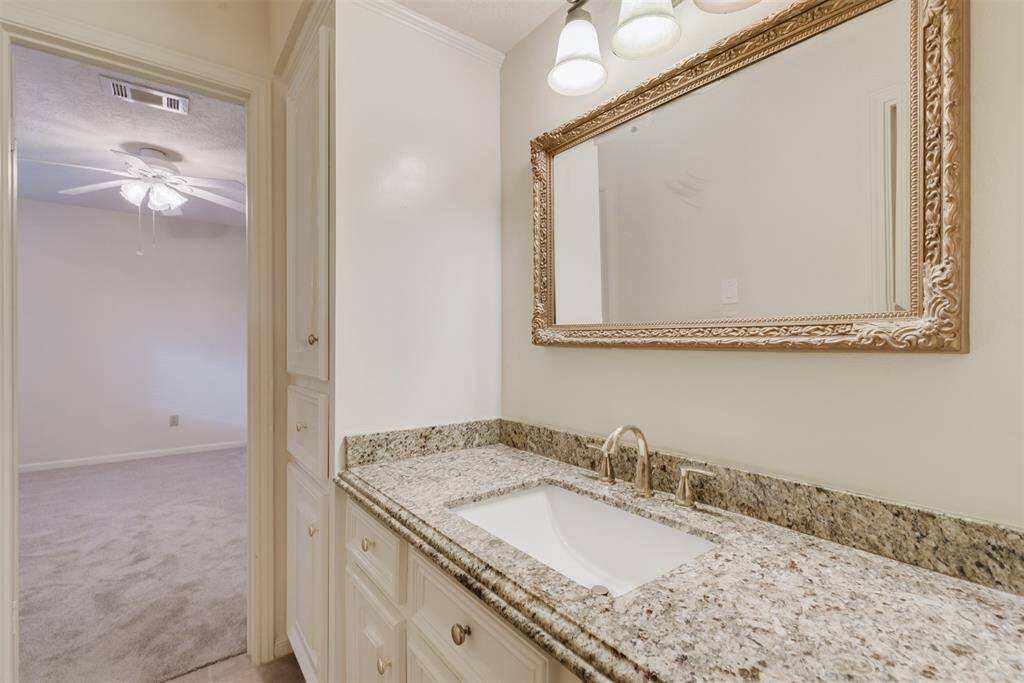 Hollywood bathroom upstairs joins two bedrooms. Updated with Granite counters, new faucets and lighting.