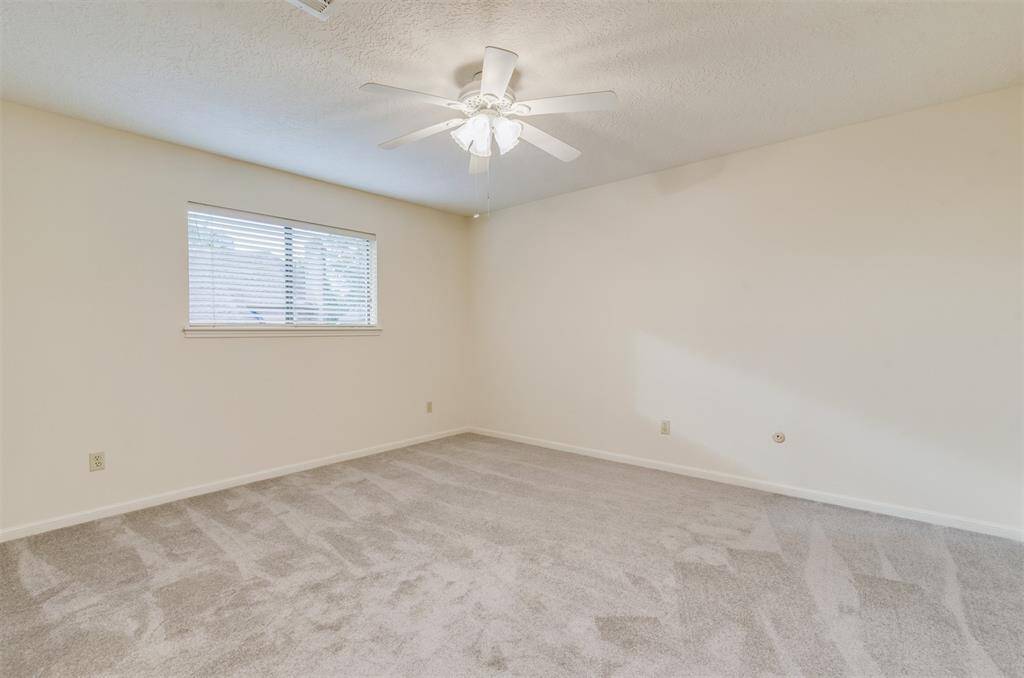 The largest of the three bedrooms upstairs has 14x13 sf of space. All bedrooms have new carpet, fresh paint, and ceiling fans.