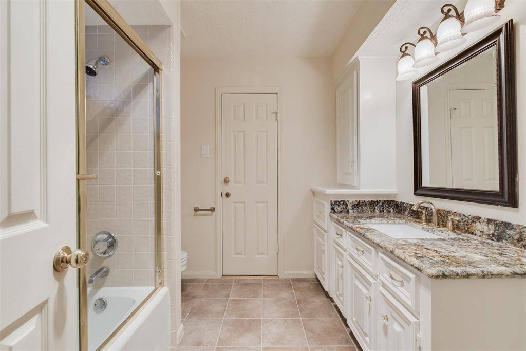 Second bathroom upstairs has Granite counter, new faucets, and a framed mirror.