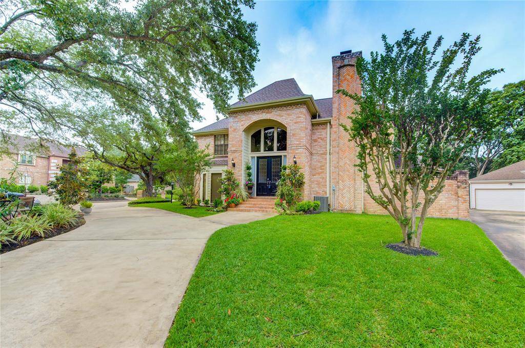 Exceptional curb appeal in the prestigious, guard-gated community of Memorial Thicket. This stately traditional home sits gracefully on an oversized cul-de-sac lot and features a timeless brick exterior, manicured landscaping, and a rare circular driveway that offers both elegance and convenience.