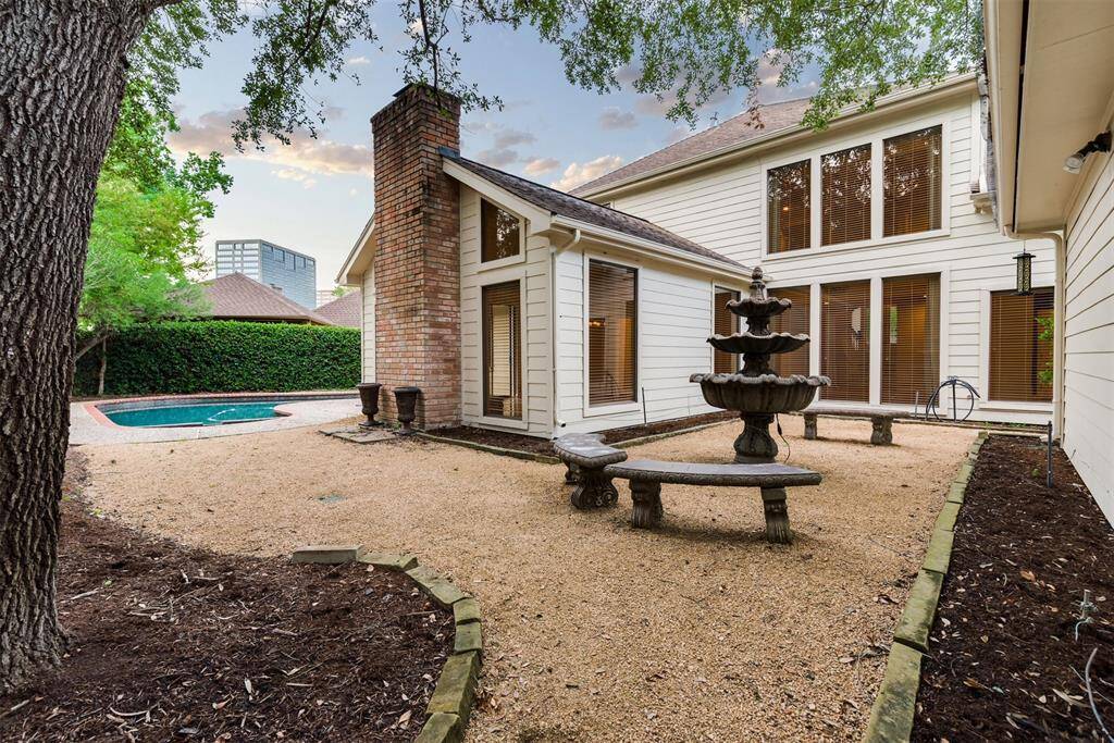 Low maintenance courtyard offers space for outdoor dining. Grass can be added here by request.