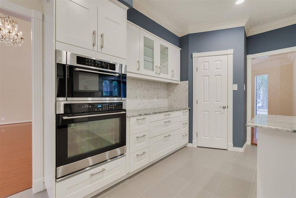 The kitchen boasts all new stainless steel appliances, including the oven and convection microwave.