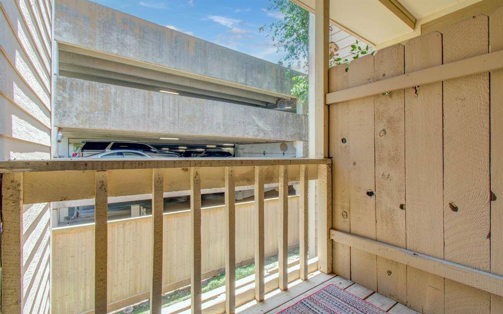 Covered balcony that can be accessed from both the kitchen and primary bedroom
