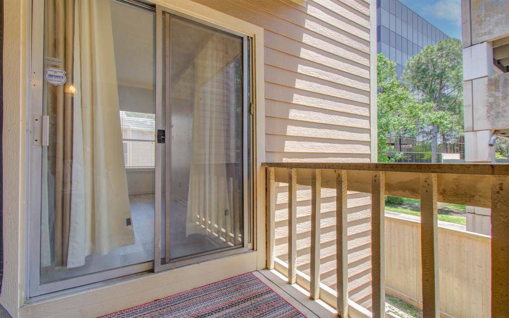 Balcony view into the primary bedroom