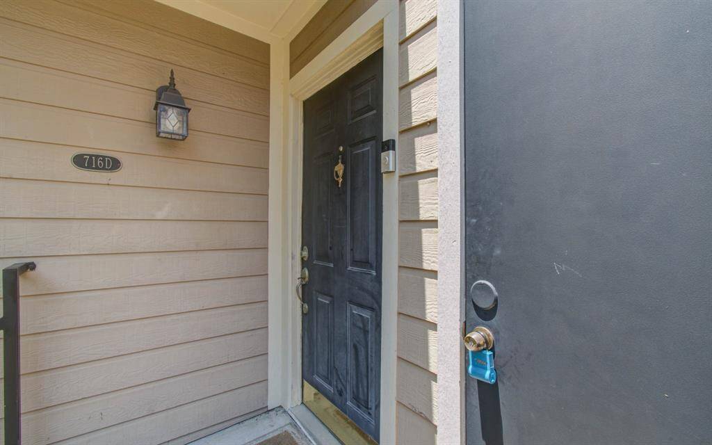 Front balcony showing front door and storage