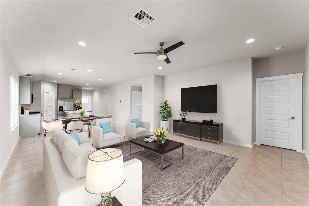 Step into the inviting living area, where natural light floods the open-concept space.