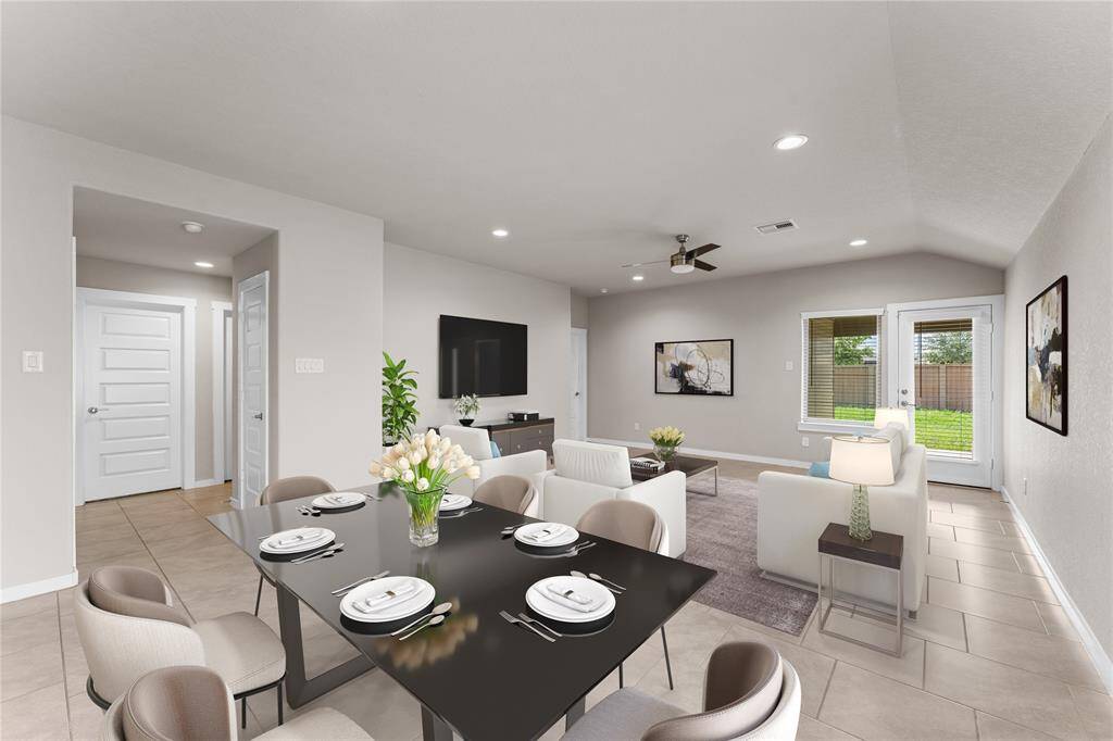 With its seamless flow into the dining and kitchen areas, this cozy yet spacious room is perfect for relaxation or hosting gatherings.