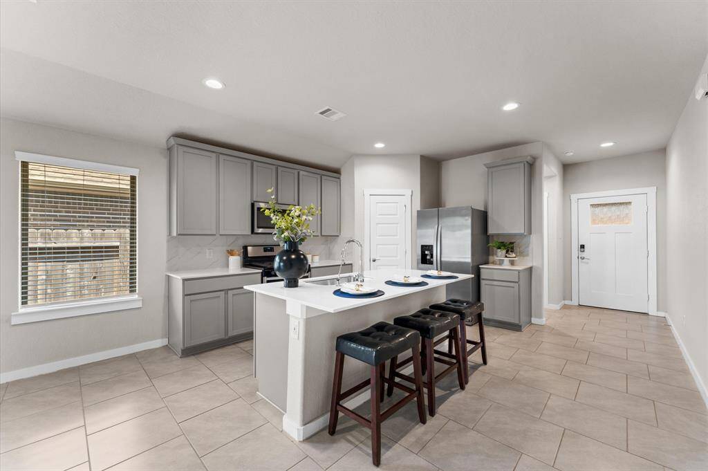 Whether you’re preparing a meal or entertaining guests, this kitchen brings both style and function to every moment.
