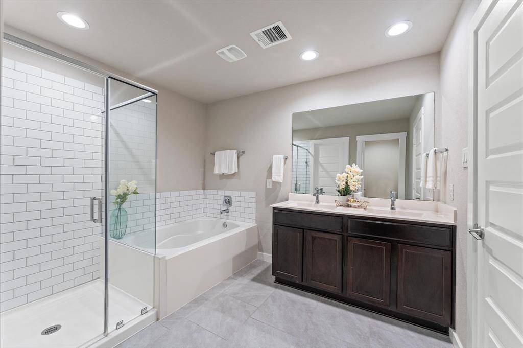 The sleek finishes and modern fixtures create an elegant atmosphere, while the expansive layout ensures you have room to unwind.