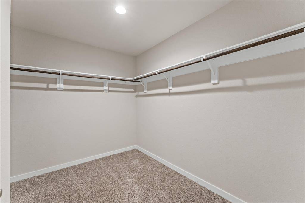 The walk-in closet is a dream come true—spacious and thoughtfully designed to keep your wardrobe organized and easily accessible.