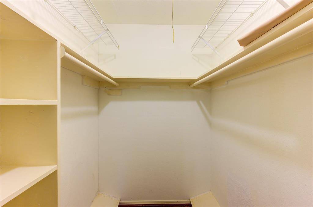Walk in closet in primary bedroom