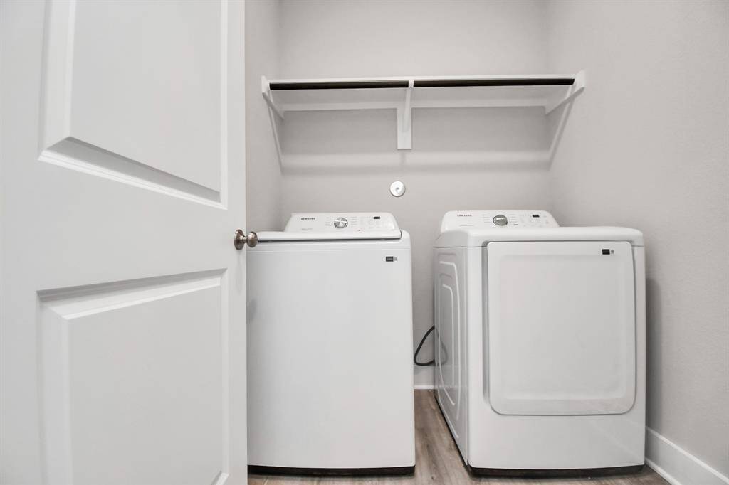 The utlity room is inside the home and features a full size Washer &Dryer