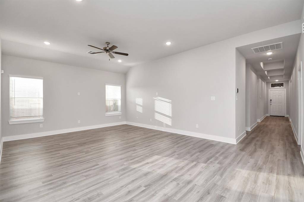Enter the front door to a sleek, modern clean look, the large living room for the family!