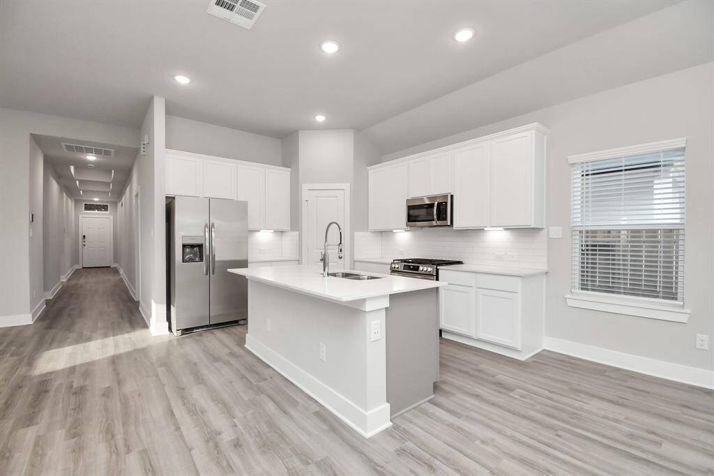 Kitchen with space for family breakfast area