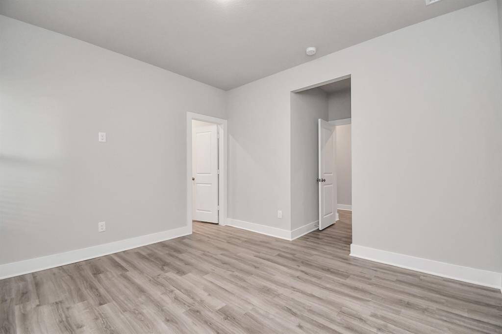 The large primary bedroom has great views and features a walk-in closet.
