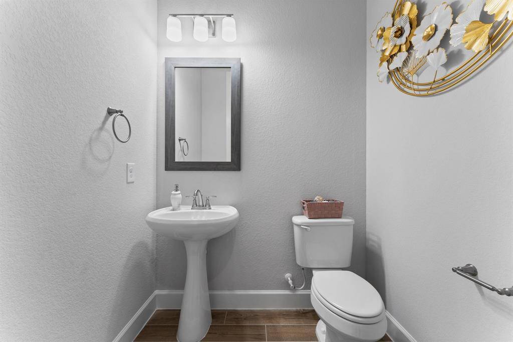 You're looking at a neat and compact half bathroom .