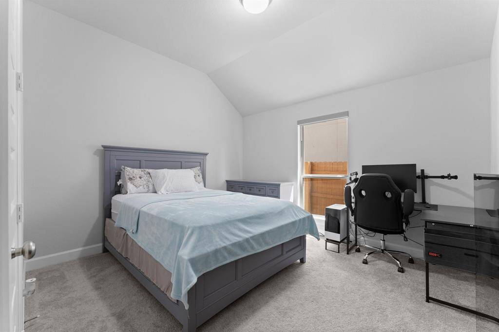 Third  bedroom showing natural light from the window, offering  a cozy, versatile living space.