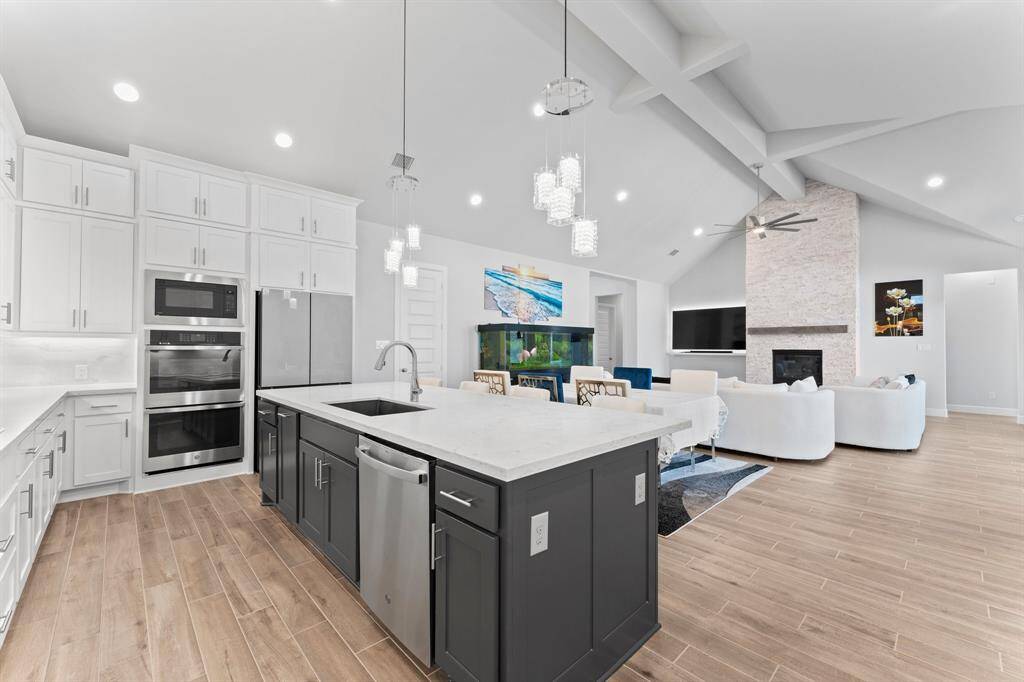 Another view of This  modern, open-concept living space creating an inviting atmosphere perfect for entertaining or relaxing.