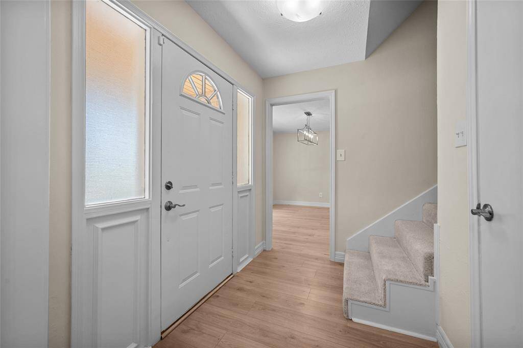 Bright and welcoming front entryway.
