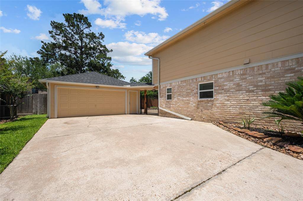 Extended driveway leading to a detached workshop or flex space