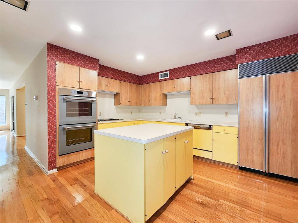Refrigerator to right of Island