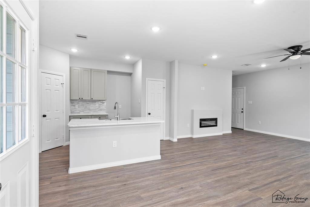 Kitchen and partial living room from dining area