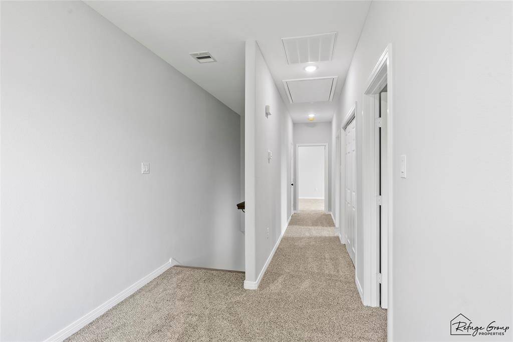 Hallway. Laundry on the right of hallway