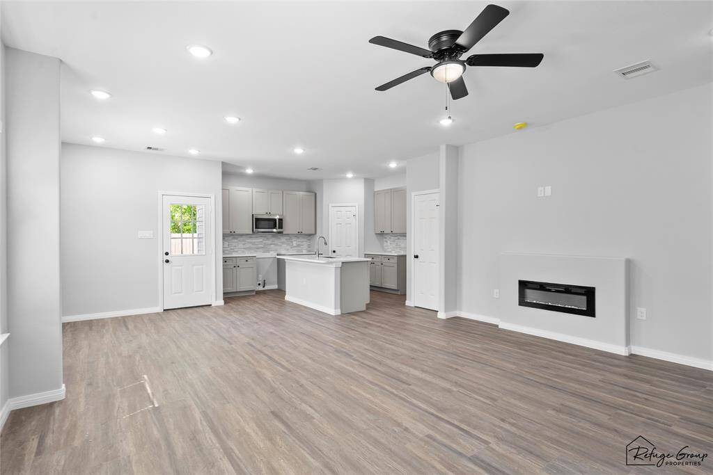 View as you walk in the front door. Open living room into the dining and kitchen area.
