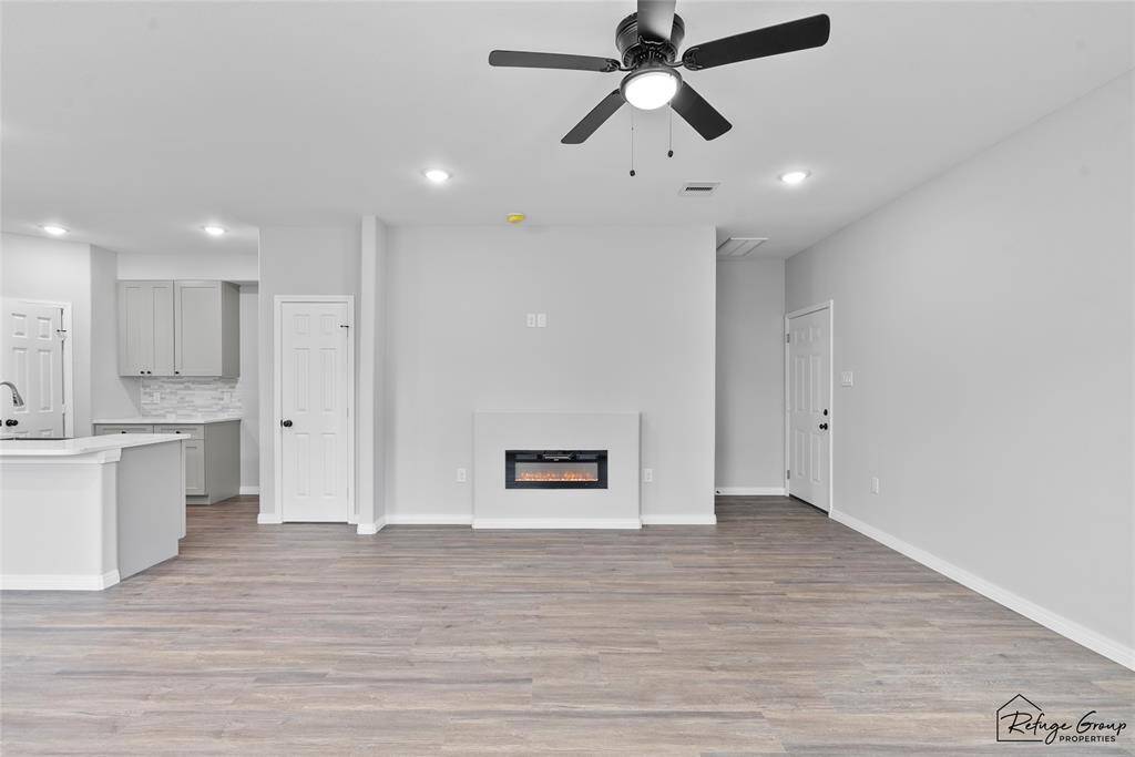 Beautiful fire place accentuates this living room.