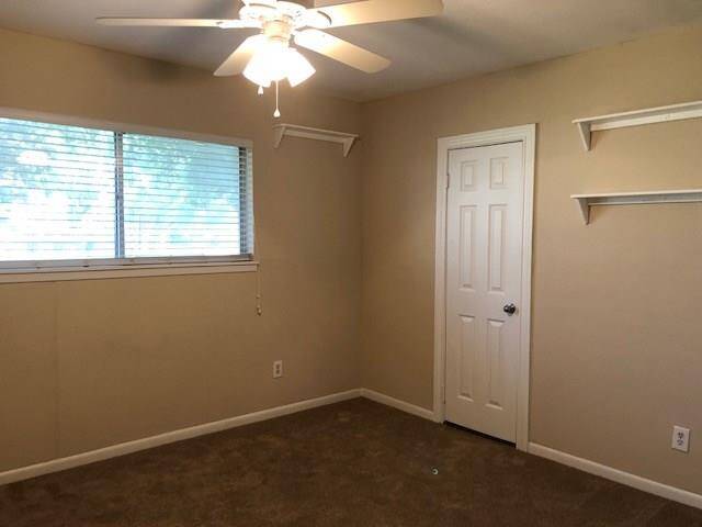 Primary bedroom with its owner private tub/shower bath area.