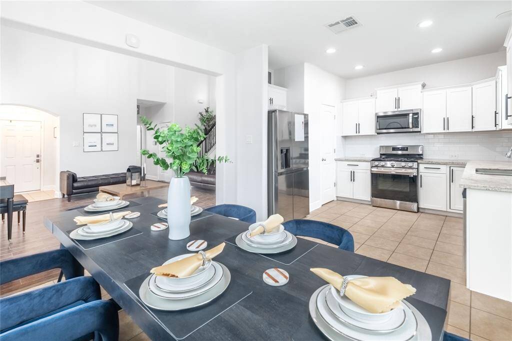 Alternate view of dining with kitchen