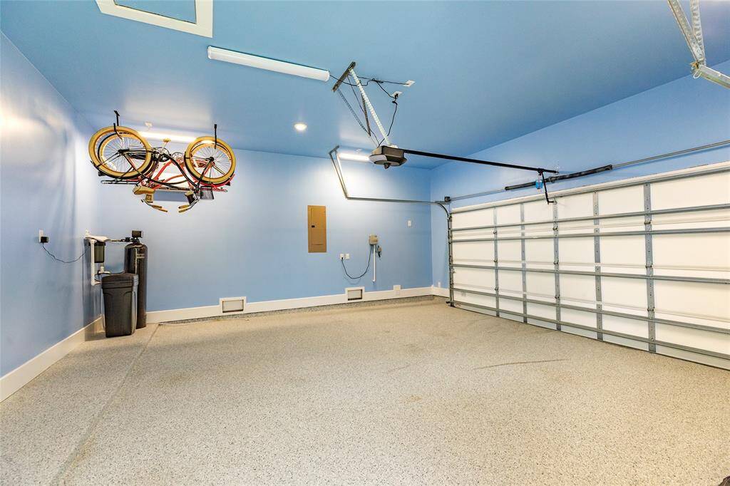 The garage of your dreams! Painted the perfect shade of blue to reduce the interests of pests, complete with access to a deck, SECOND attic, ultra bright led lighting, oil resistant epoxied flooring, a mini split AC unit, and a level two EV charging station! It's special for sure.