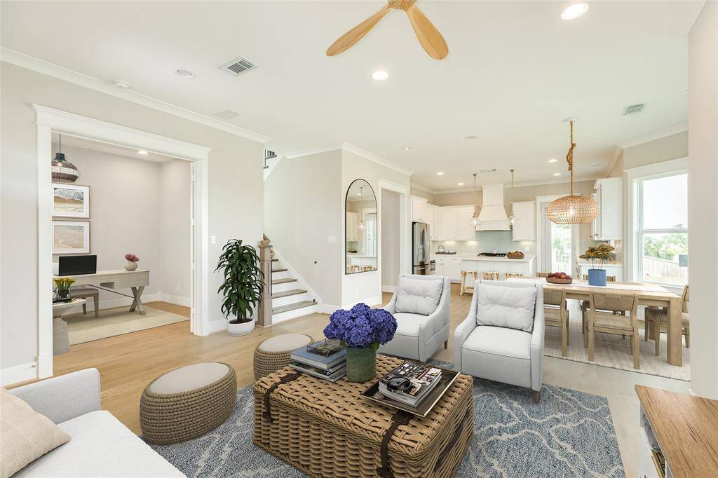 VIRTUALLY STAGED - This angle shows the study on the left and looks across the open floor plan into the kitchen.