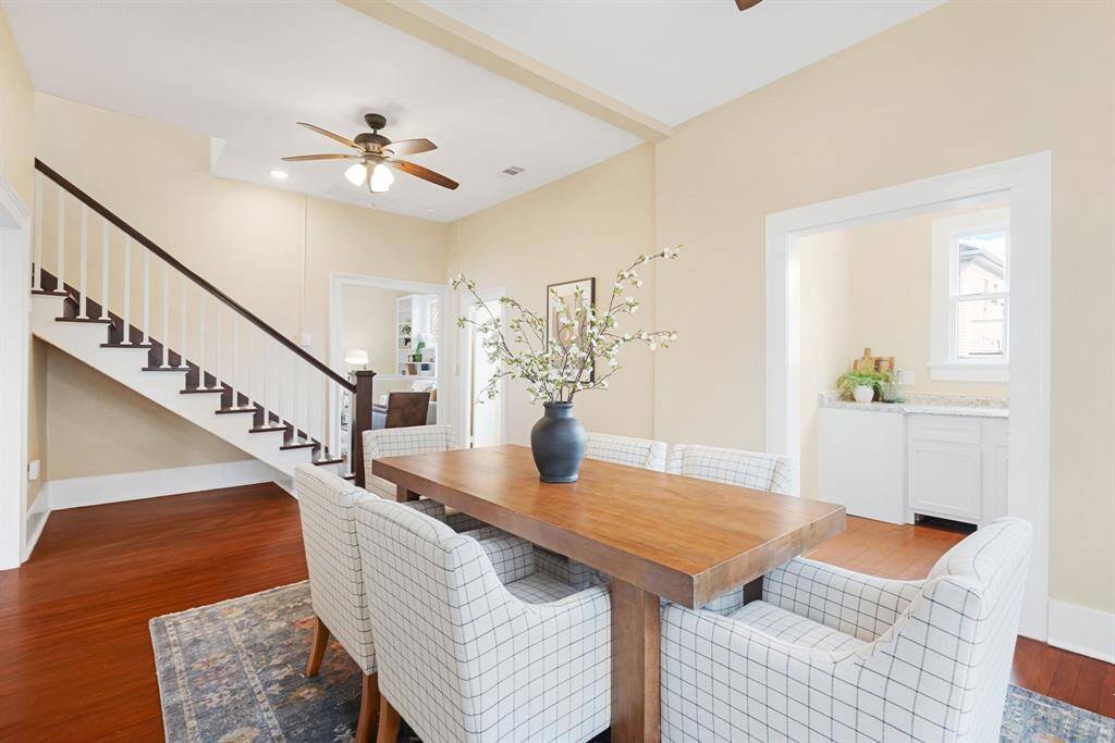 Unit 1: Seamless layout. From the dining room, enjoy easy access to both the kitchen and living room, plus a wide staircase leading to the upstairs retreat.