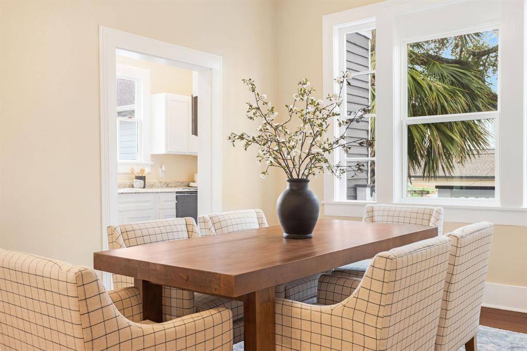 Unit 1: Picture-perfect setting. With beautiful backyard views and crisp, coastal design, this dining space is the heart of the home. It’s as functional as it is beautiful.