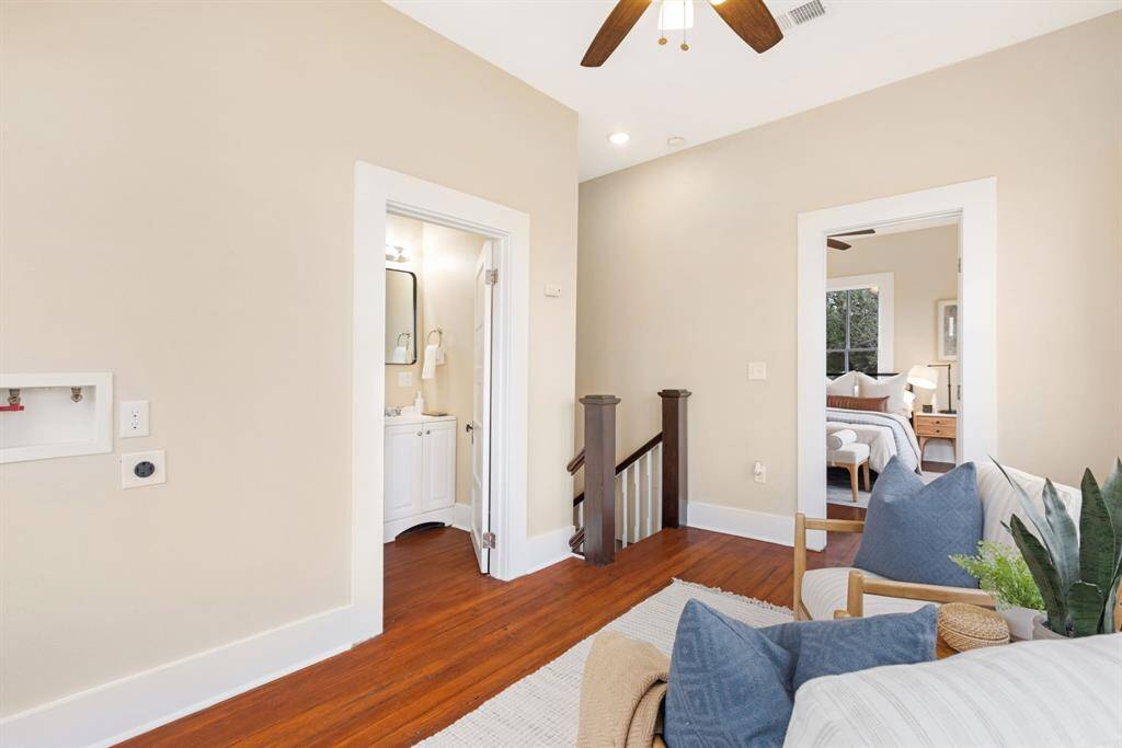 Unit 1: Light-filled landing. At the top of the stairs, discover a charming flex space—perfect as a reading nook, home office, or quiet lounge to enjoy the views.