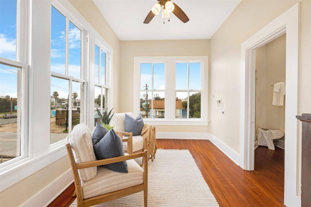 Unit 1: Bright and breezy. Large windows wrap the upstairs landing in sunshine. It's a cozy corner to sip coffee, journal, or simply watch the world go by.