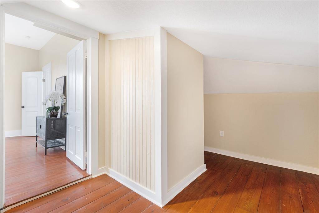 Unit 1: Bonus storage space. Tucked just around the corner, this closet adds valuable storage and character to the upstairs bedroom—perfect for stashing extra linens, seasonal items, or creating a hidden reading nook.