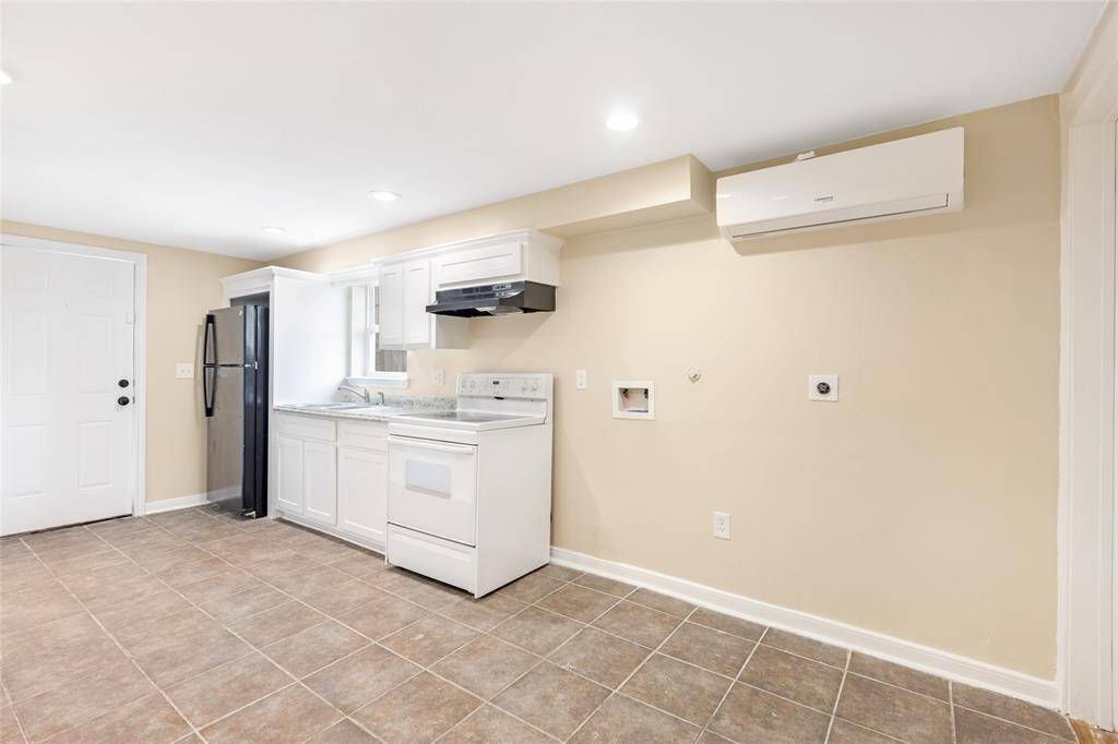 Unit 2: Laundry made easy. This wall nook is prepped for your full-size washer/dryer. Tidy and convenient.